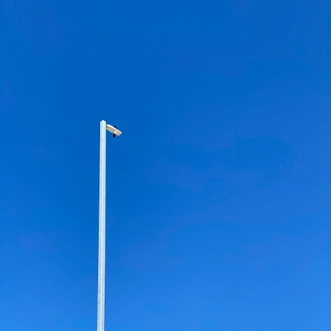 white metal pole under blue sky during daytime