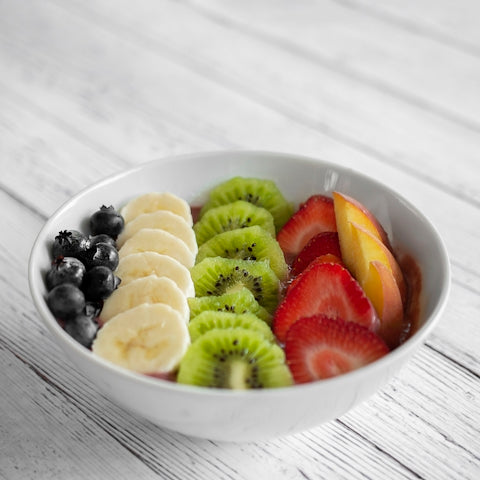 bowl of sliced fruits