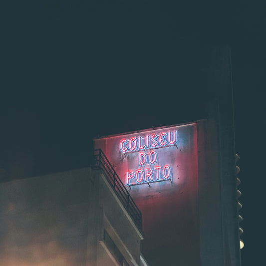 a neon sign on the side of a building